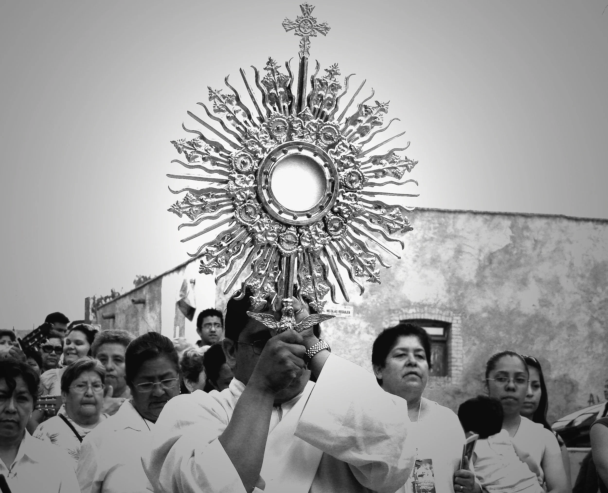 This photo was taken back in 2009 when I was living in Saltillo, Mexico as a missionary. I decided to document the Eucharistic procession on this amazing feast of Corpus Christi. It was an awesome experience to walk through the neighborhood around t…