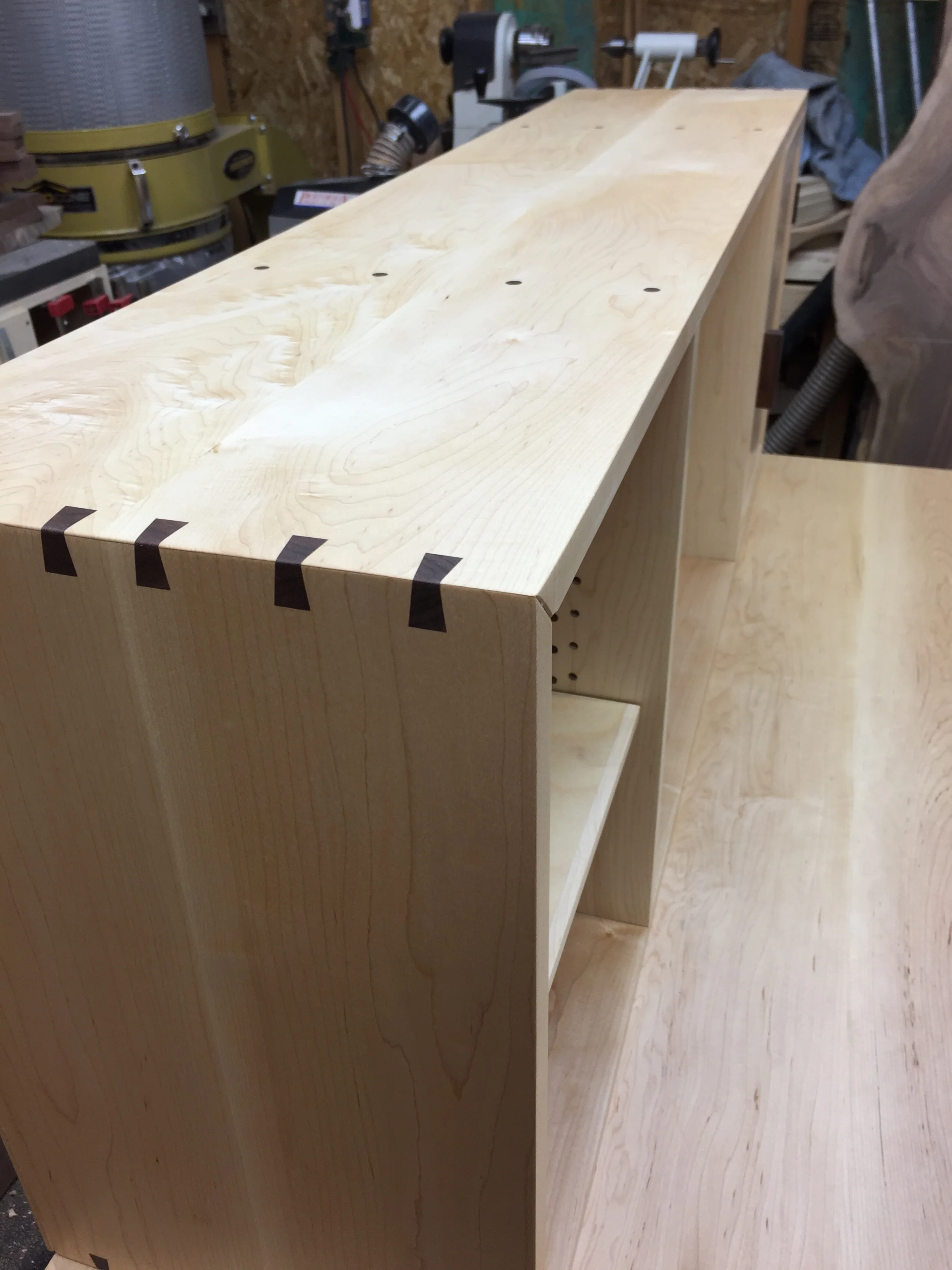 Walnut sliding dovetail splines, used to reinforce the miter joints.