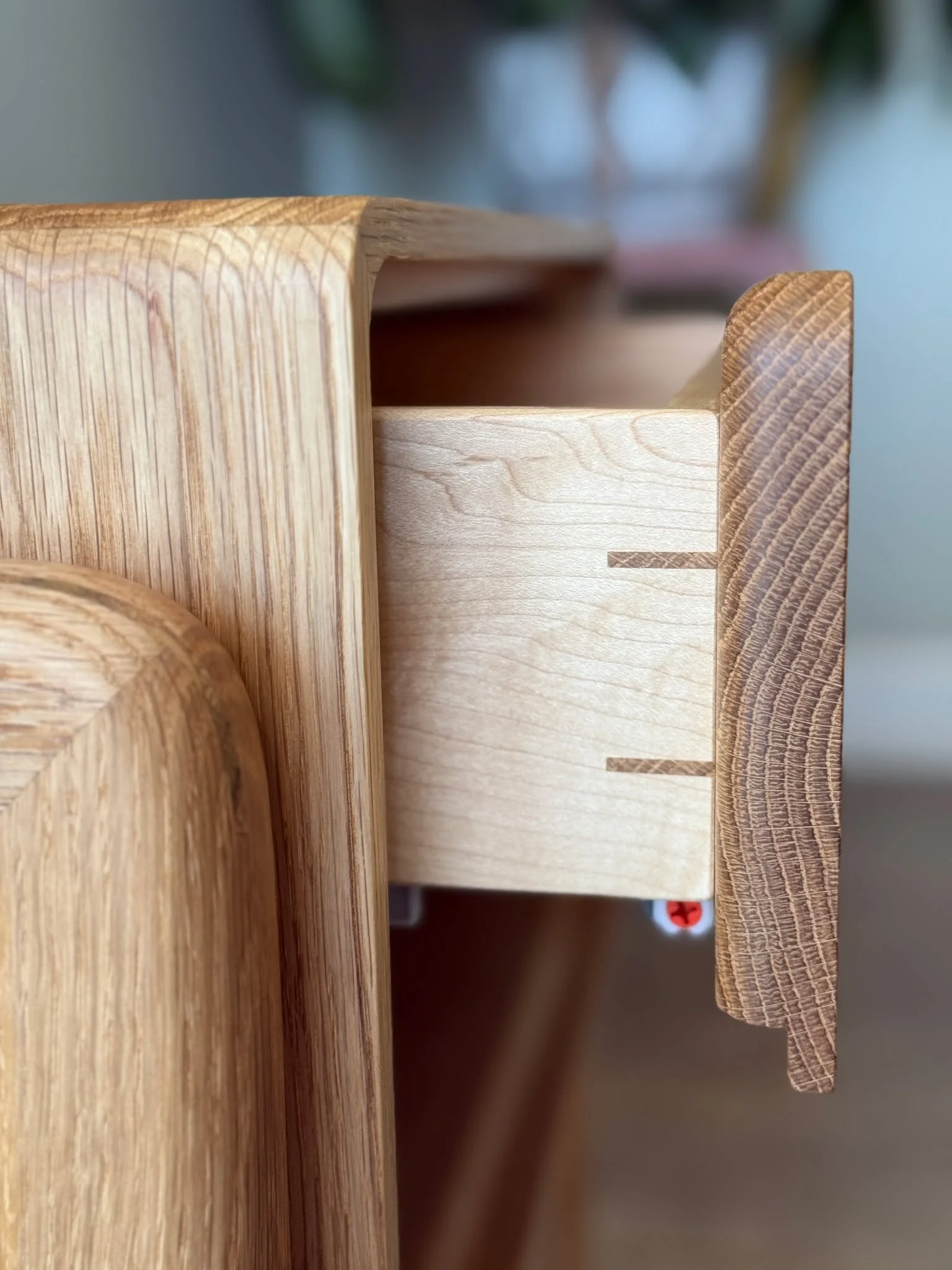 Custom June nightstands in white oak from earlier this year. Did I post these? I really can't remember anything anymore.

The custom part (for some great repeat clients) are the side-mounted legs to match a bed they found. I coordinated that shape wi