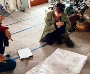 Reviewing drawing set on site.