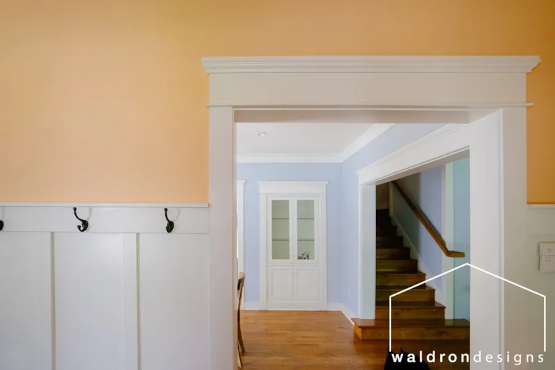 The homeowners wanted a warm and welcoming entry, and with blue being his favorite color, its complement seemed like the perfect choice!