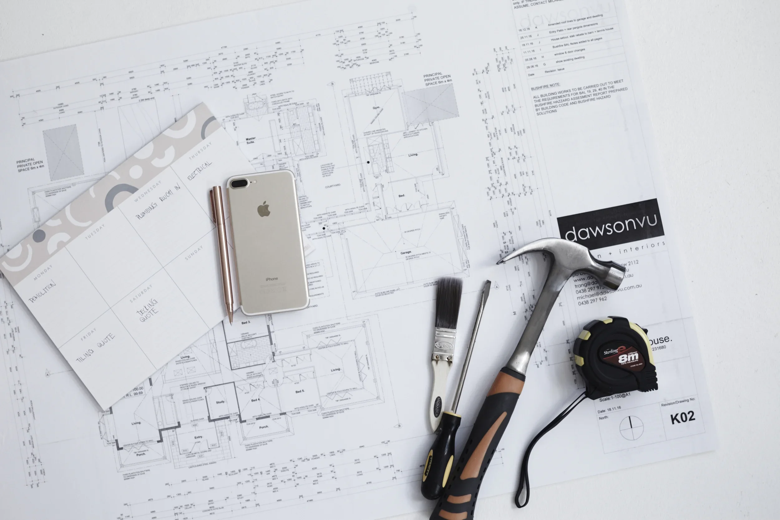 Architectural drawing with cell phone and calendar