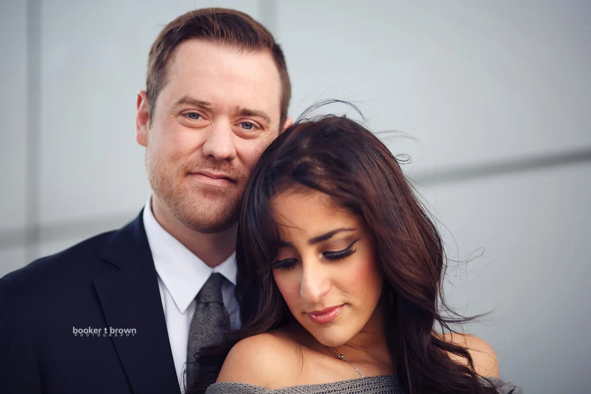 Beautiful couple shares an embracing moment near the Kauffman Performing Arts Center