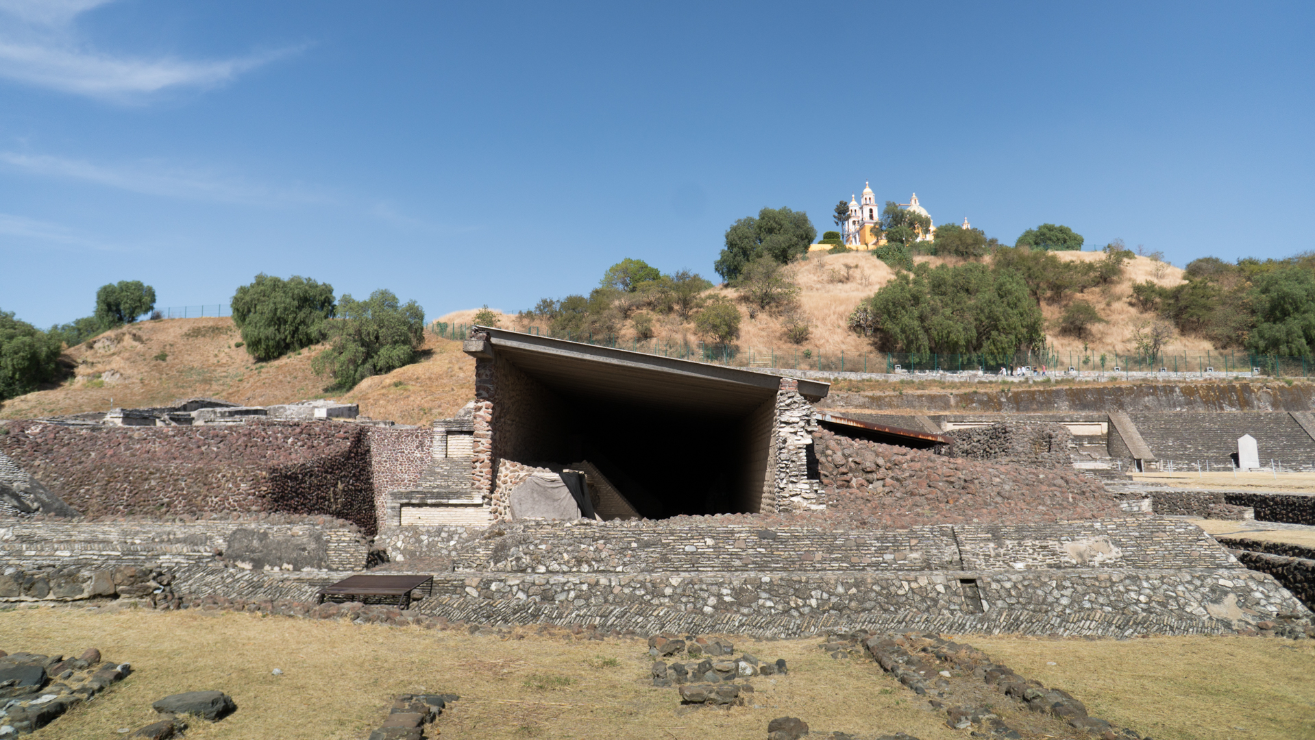 A covered archeological dig amidst the ruins.