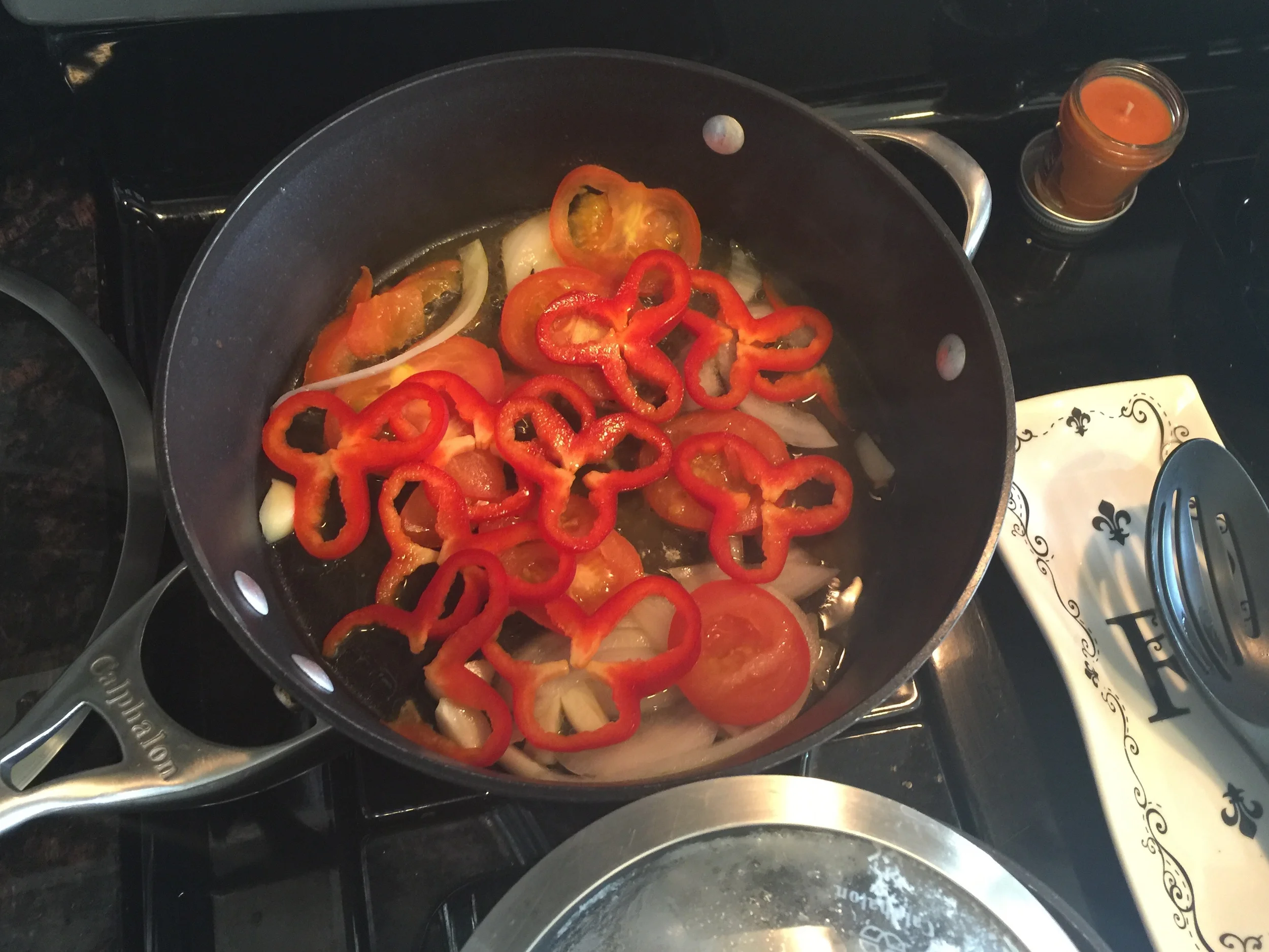 Meanwhile sauté your fresh tomatoes, onions, and red bell pepper with olive oil & fresh garlic.