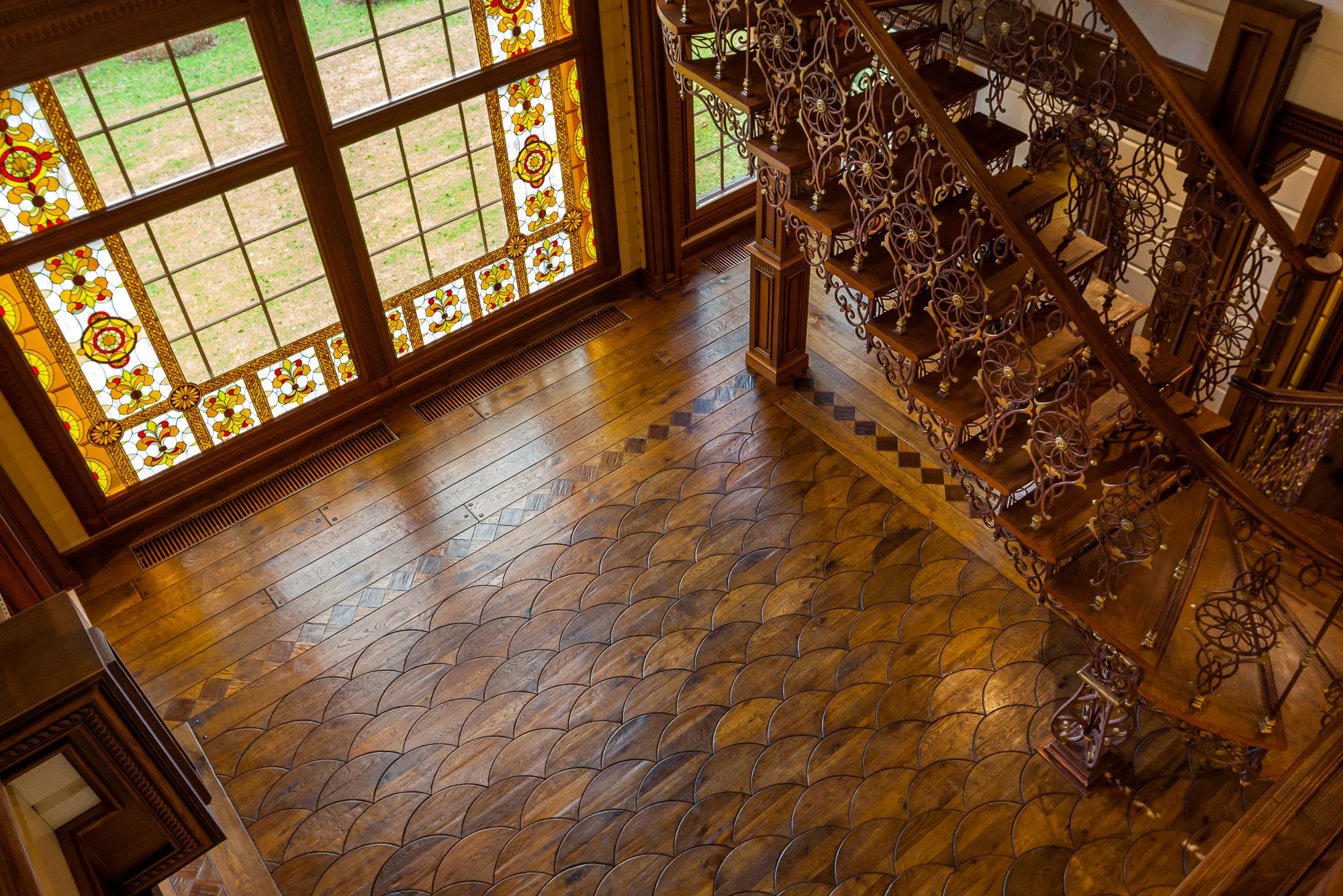 Custom made dovetail pattern and complementary borders and planks in reclaimed oak, antiqued, stained and burnished with vegetable oils and waxed with beeswax. 