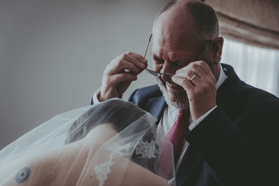 Father of bride crying with his daughter