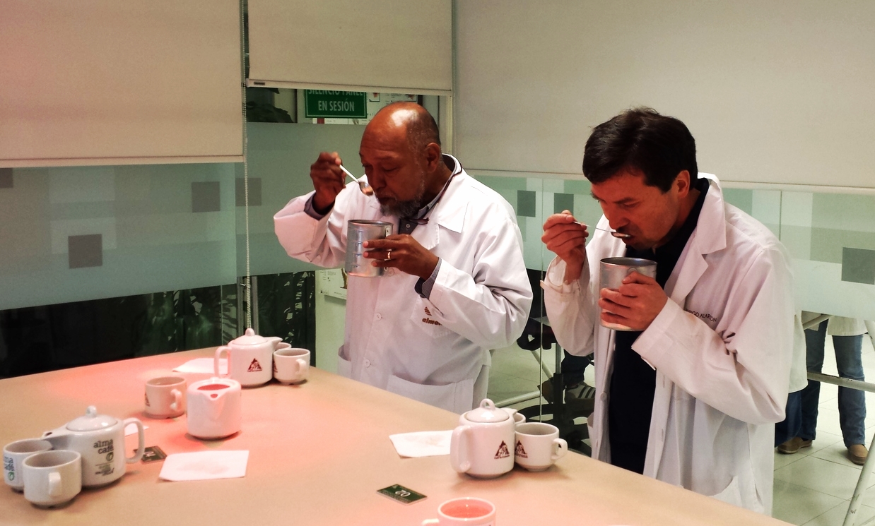 Edgar (left) cupping coffee in Bogota