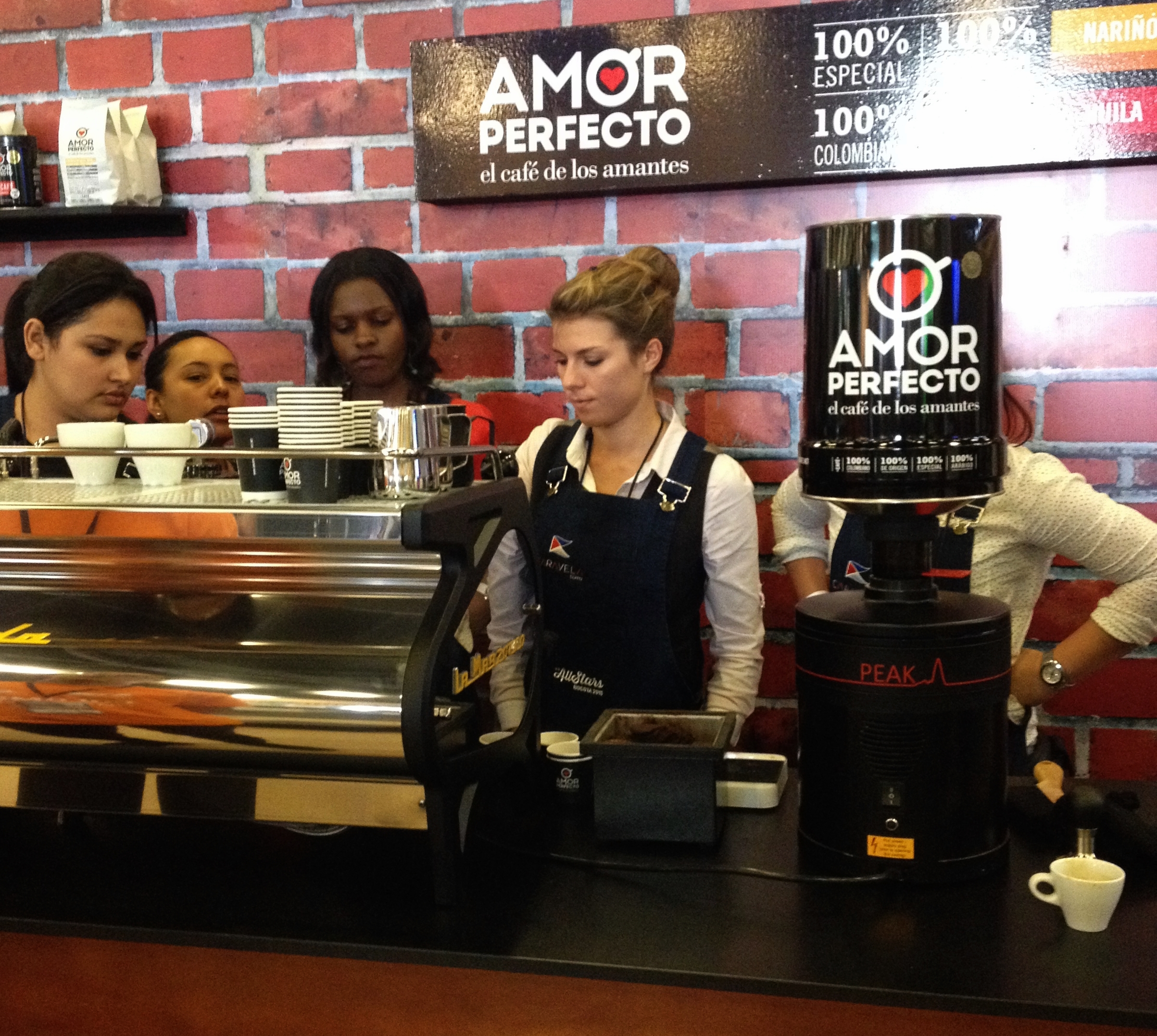 Baristas training at Amor Perfecto's stand for the Barista Female All Stars event