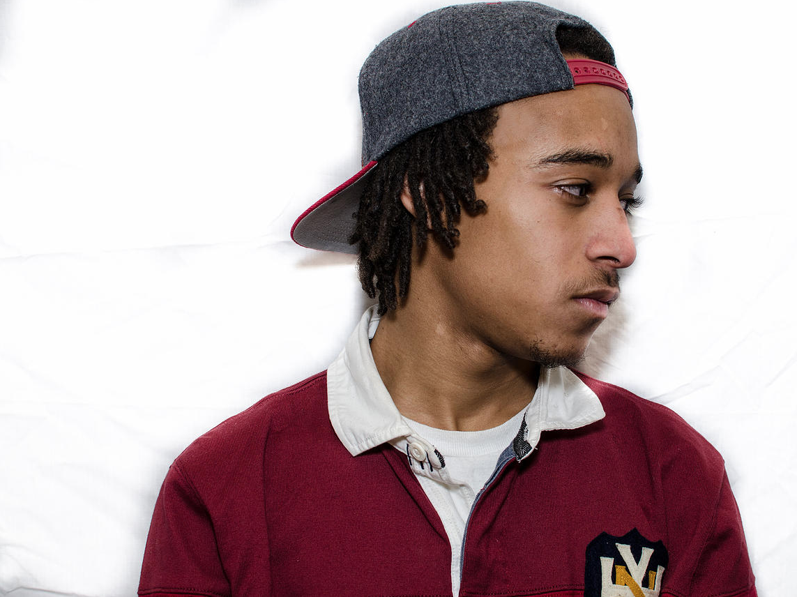Perry Rodrigues, A.K.A. Perrion, is an emerging young artist from Harlem—151st between Amsterdam and Broadway to be exact. His age, 23 years, is merely a statistic of how long he has been here, as a listen through any of his five mixtapes will allude to experience and instinct beyond his years. Perry’s rap style is an unbelievably interesting reflection on the household he grew up in, with a father who loved and collected rap music as an avid fan, but instilled in him the values of maturity and adulthood. His music also considers the ways in which the context of the culture he grew up in permeated his own personal values and understanding. He’s been around a while, and definitely seen a lot at a young age. However, he managed to find success in music at a young age, and his style and content have filtered through experience in skateboarding, producing, and drumming in a punk band. He received a record deal with Universal at age 13 with his older brother Preview, and has since collaborated with the likes of Joey Bada$$, A$AP FERG, and numerous others. Perry’s humble foundation alludes to the idea that he truly just hopes to be one of the lucky handful to turn what is truly their greatest hobby into a life and career.