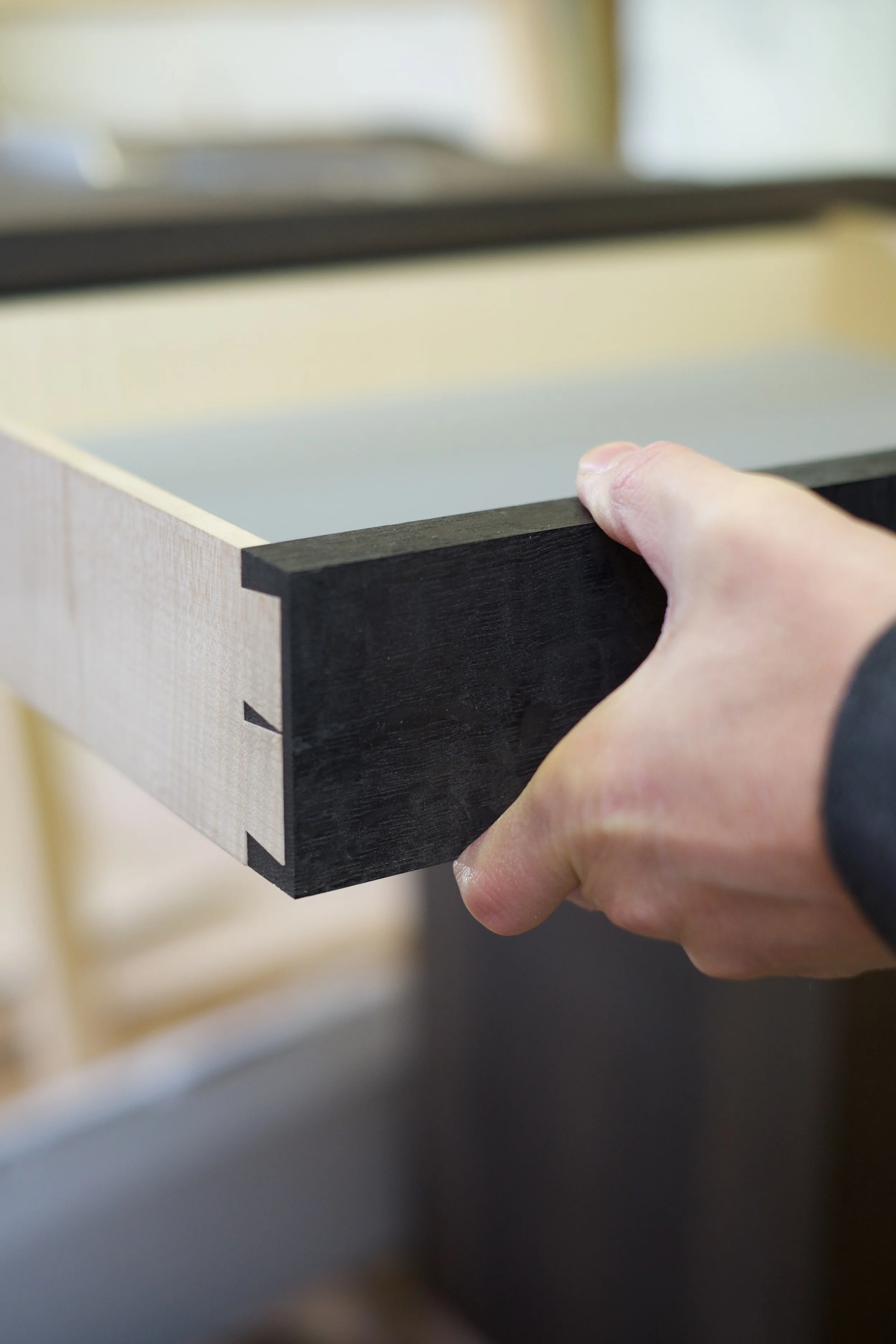 Leather-lined drawer made from rippled sycamore and bog oak. 
