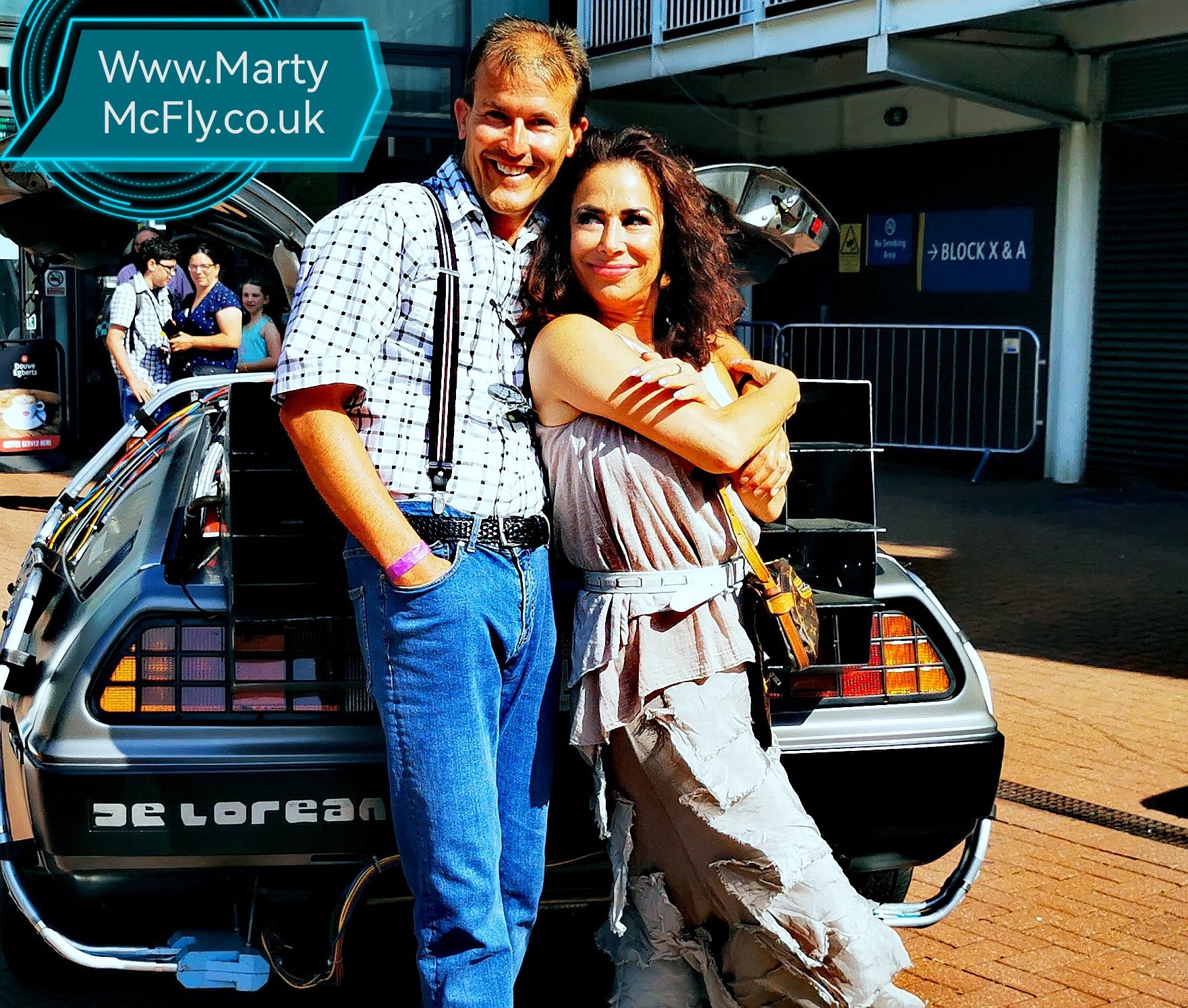 Claudia Wells with Mark Elliott Time Machine DeLorean.jpg