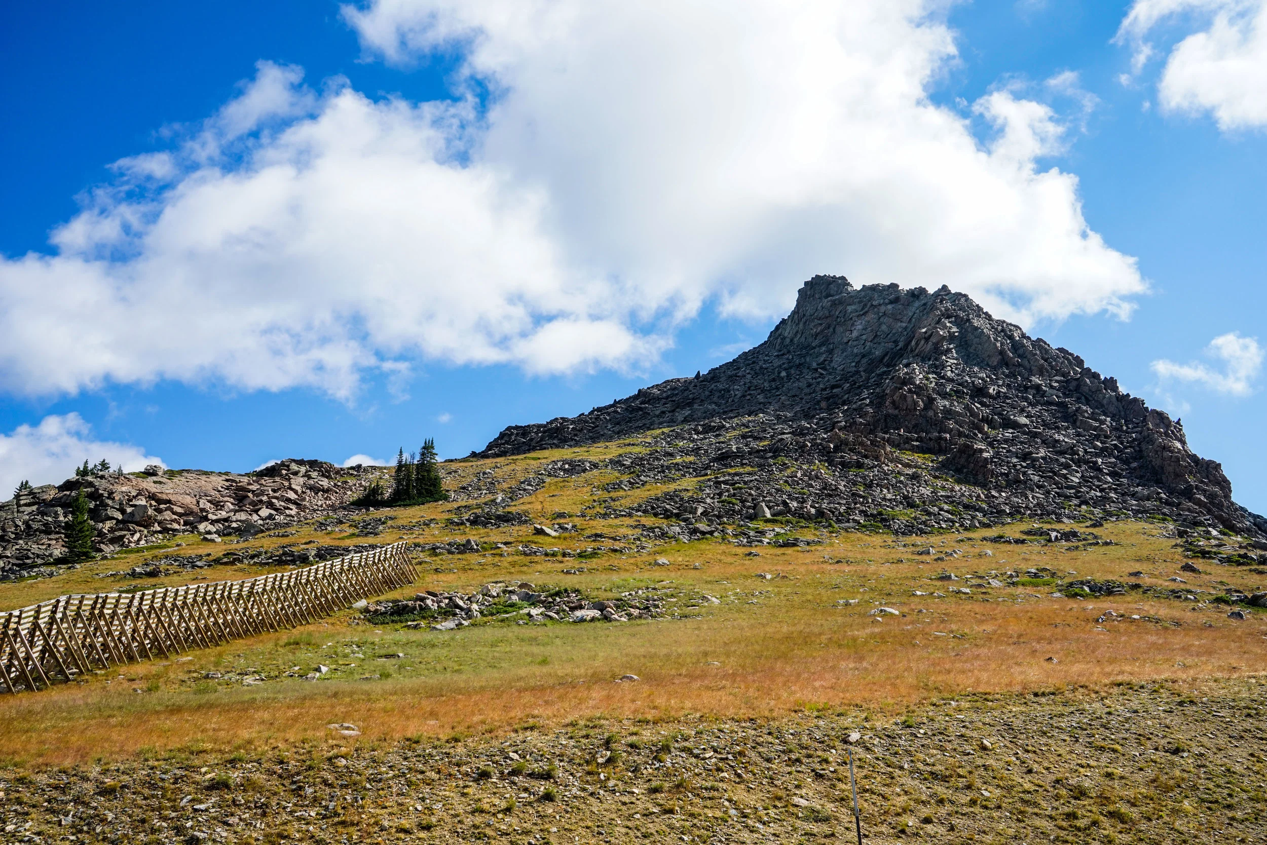 A picture of what we decided to climb up to get as high as we could. We tackle this from the west side of the photo, scrambling up large rocks and then eventually climbing to the high peak you can see in the center of the formation.