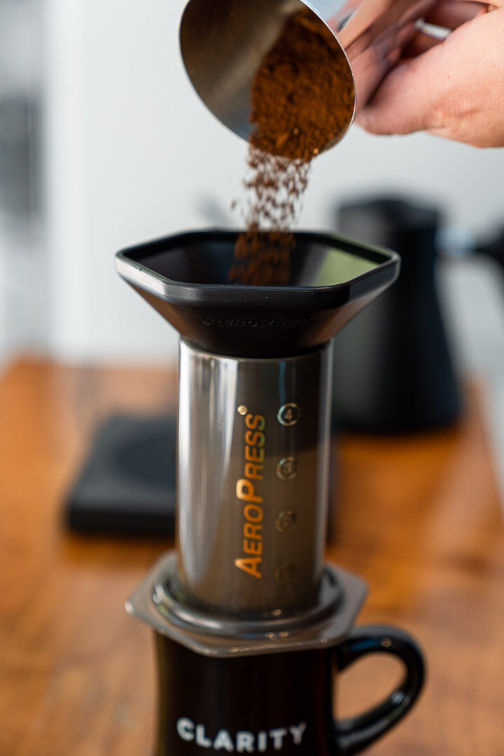 Add coffee grounds to AeroPress