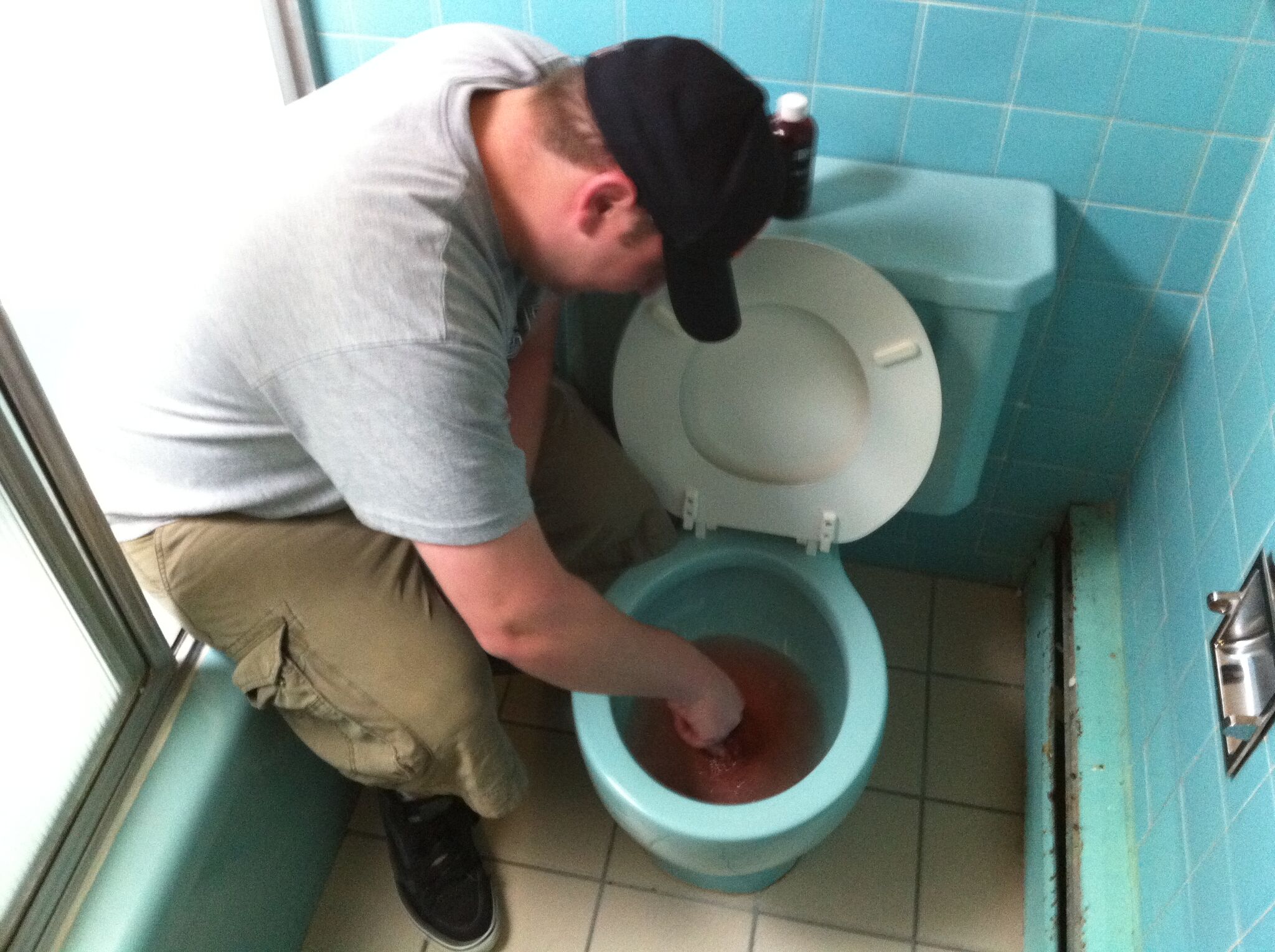 Schmidt prepping the toilet.