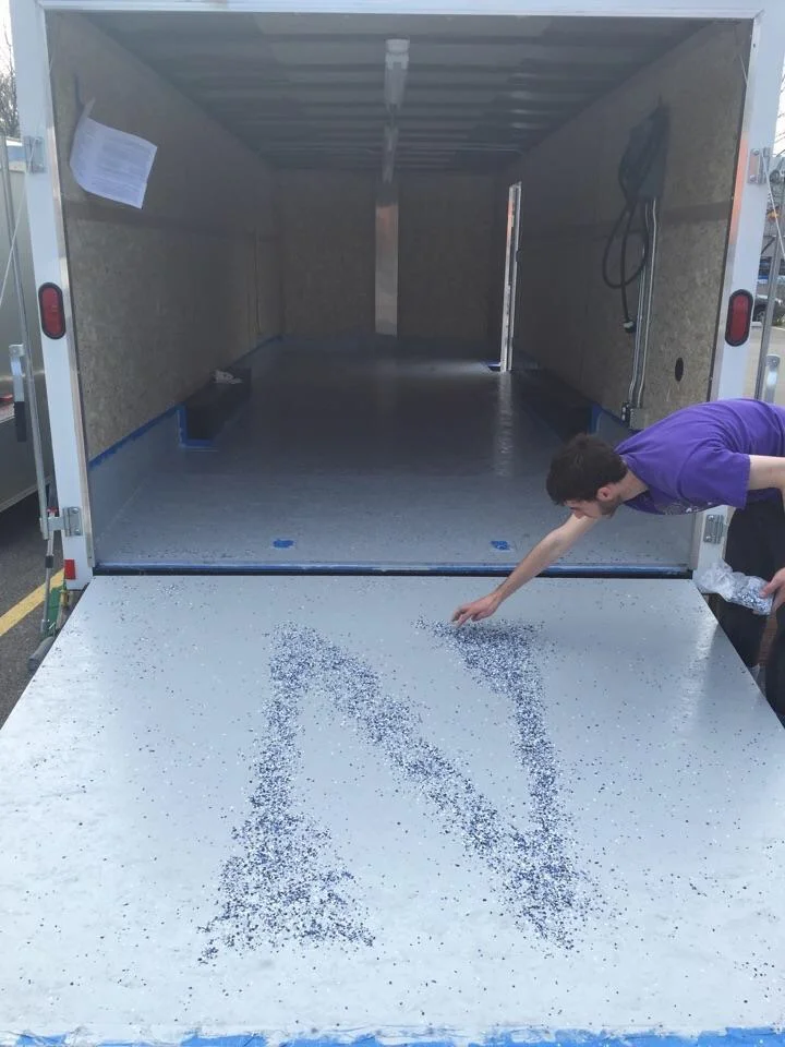 Mikey putting the finishing touches on the trailer flooring