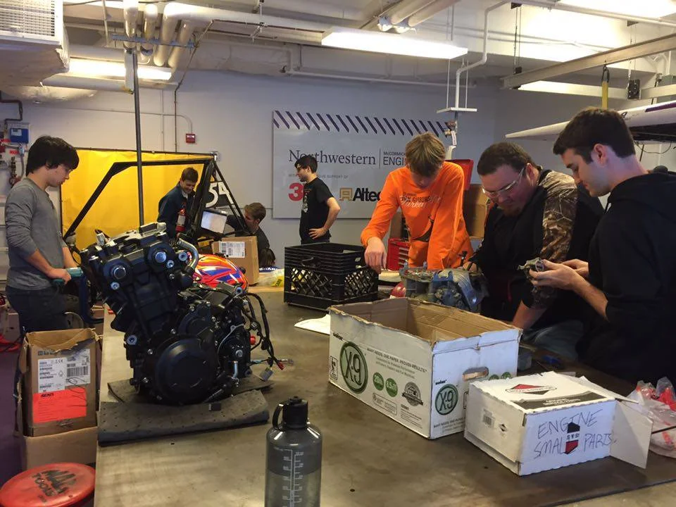 Busy busy...Will coping tubes, Alex supervising rear suspension disassembly, and Colton, Spencer, and Eric taking apart the engine.