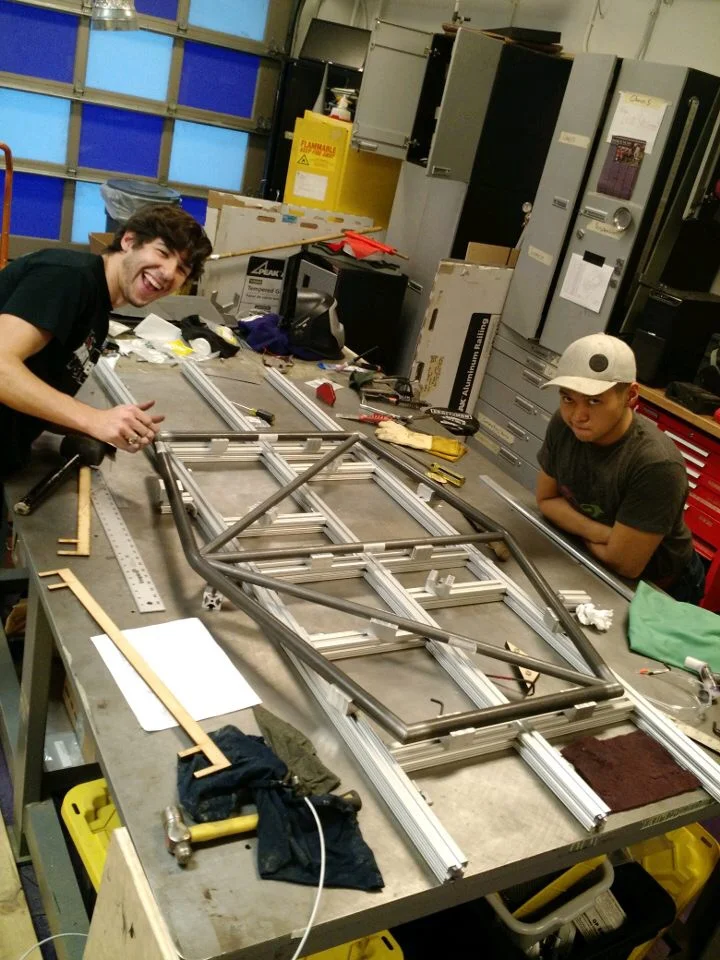 Armando and George persuading the rear roll hoop to fit properly.