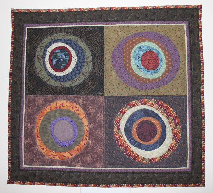Circle of Friends was hand appliqued, machine pieced and machine quilted. I love the effect of the wavy fabric on the lower right and border. I must look and see if I have any more of that!.