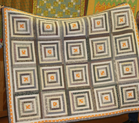 Log Cabin Renovations was machine pieced by me and machine quilted by Lynn Jones.