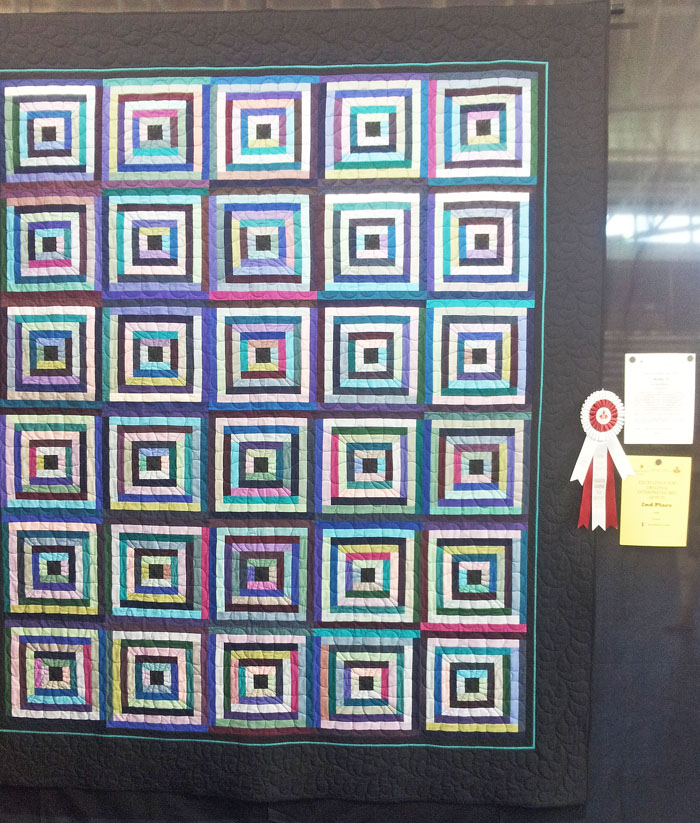 Making Do at the Canadian Quilter's Association's National Juried Show with a second place ribbon in the "Original Interpreted Bed Quilt" category. I couldn't get to the show in Lethbridge, AB and asked a friend if she could take a picture for me. "They" do not allow pictures in the NJS, strange because they publish a catalogue with all the pictures of all the quilts. I hope I don't get "in trouble" for posting this picture but I am just so very pleased! I hope CQA will reconsider their policy for "no photographs", I think it is time!