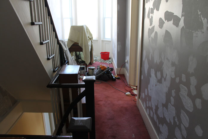Looking towards the "bump", the walls are prepped, just need sanding and they will be painted the same lovely yellow as downstairs. The carpet is gone now and it is so much brighter.