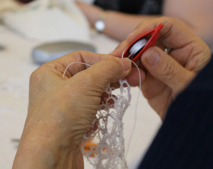 I love watching all the hands at work. This was a woman tatting, she was sitting behind me. Beautiful work!