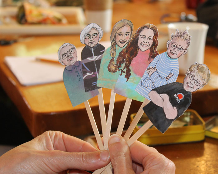 Margi's wonderful stick puppets of herself and Brain and four of their grandchildren