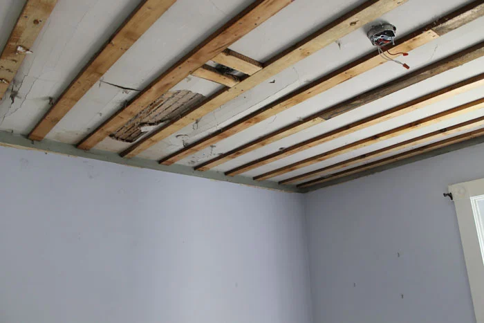 The cracks in the ceiling.