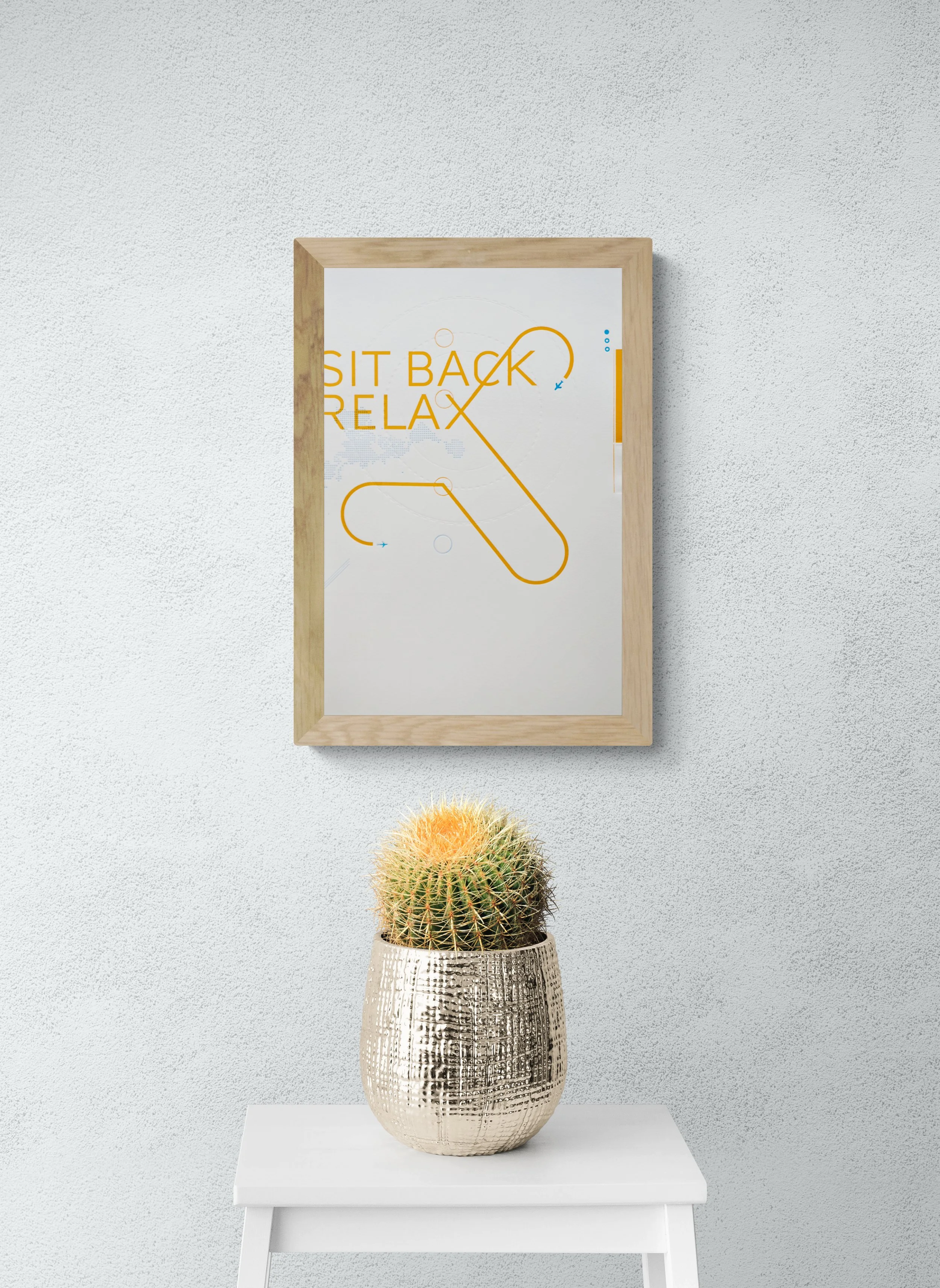 Sit Back 11.5×18 letterpress wall art shown in a contemporary living space
