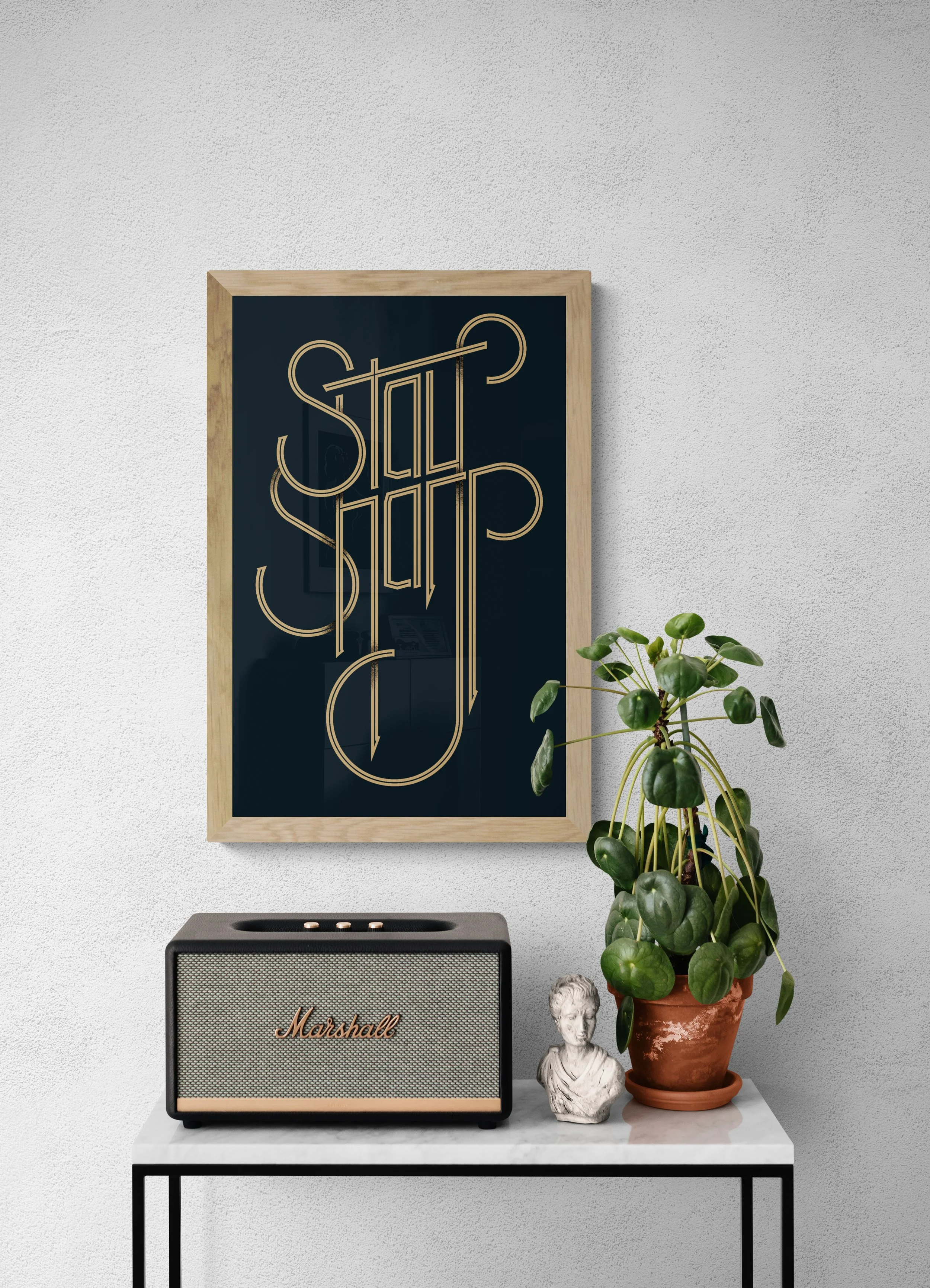 Stay Sharp 16×25 gold typography screenprint displayed in a modern home interior