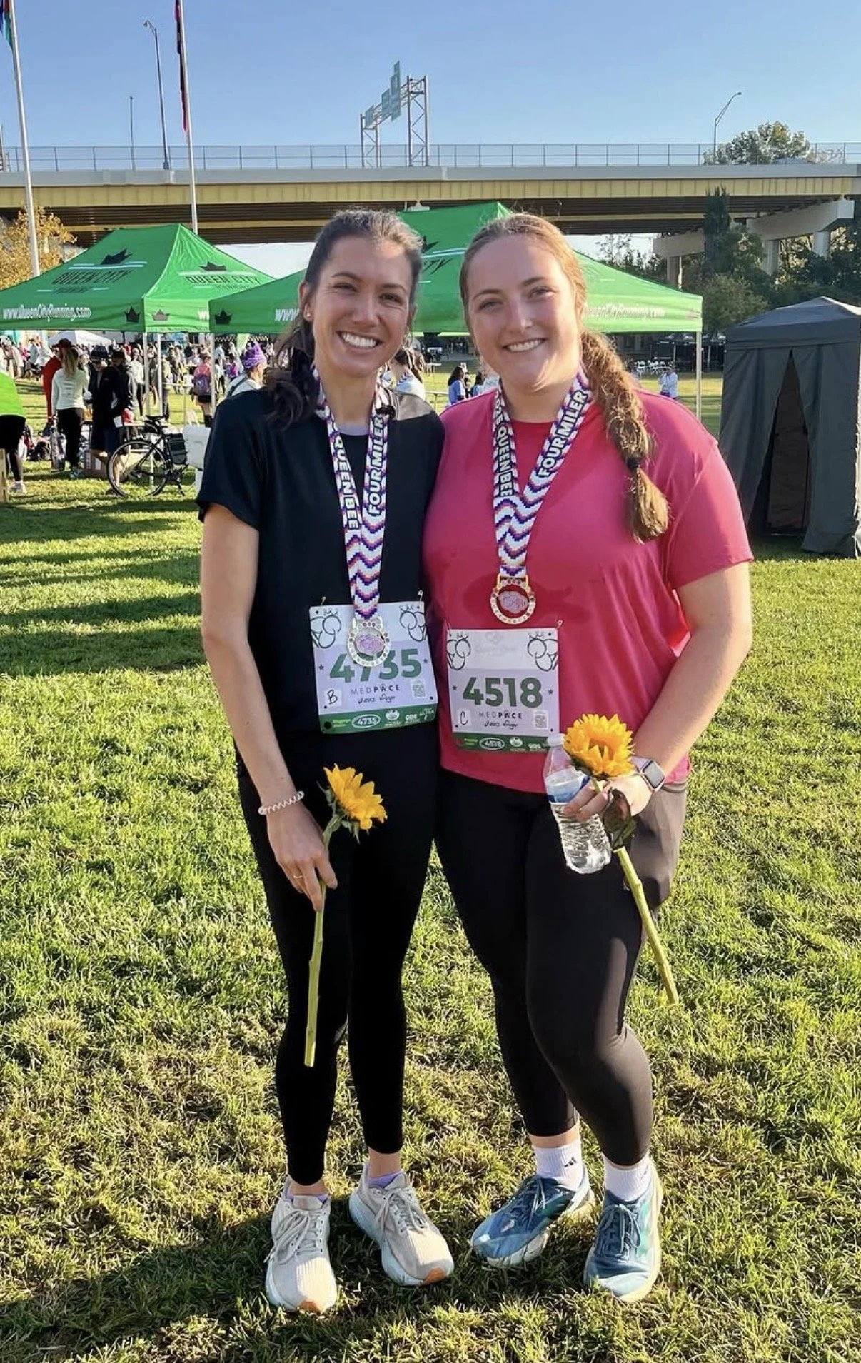 Two women with running medals