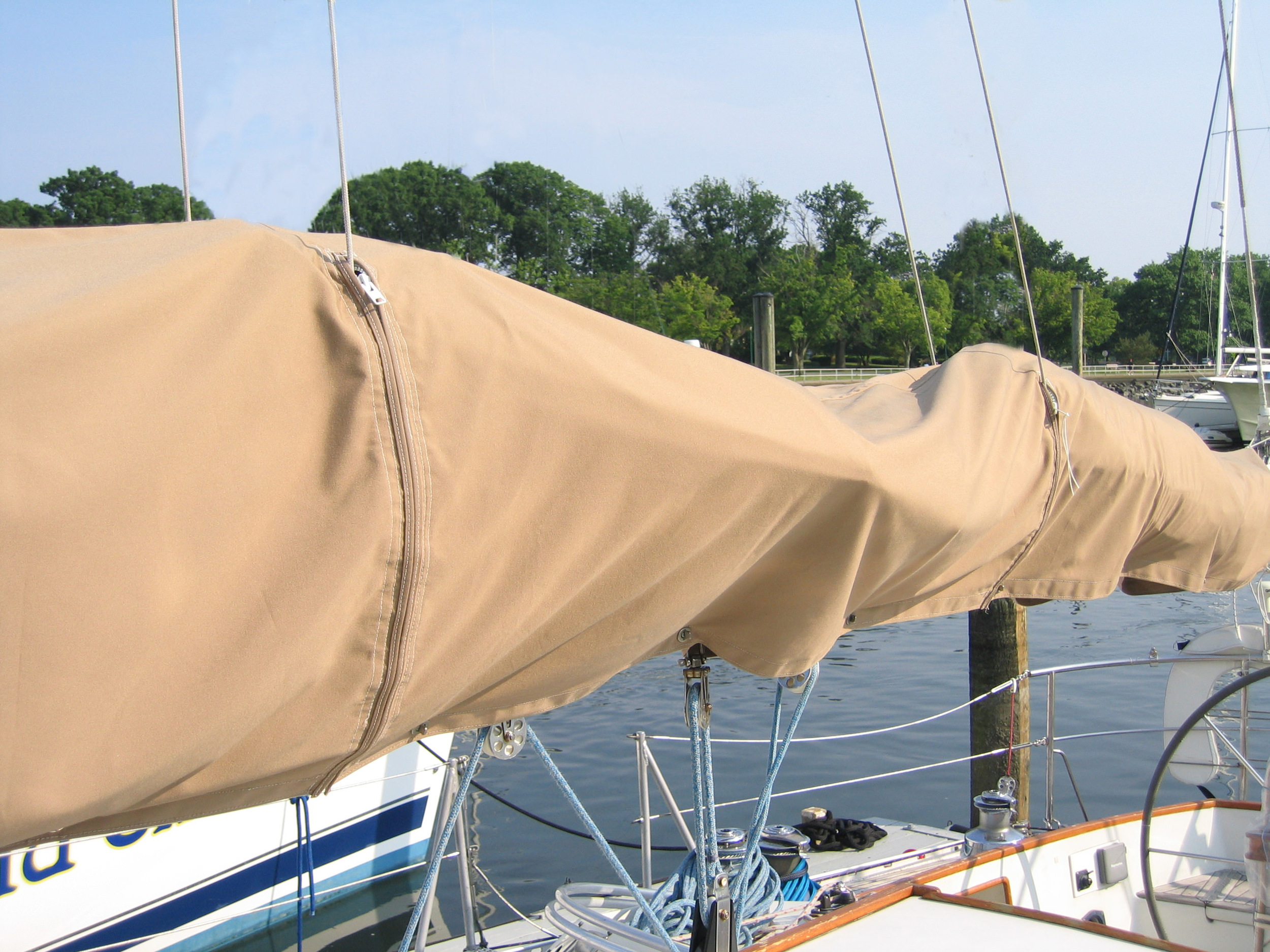 Sail covers need zipper slits to go around lazy jacks when the lazy jacks are left deployed.