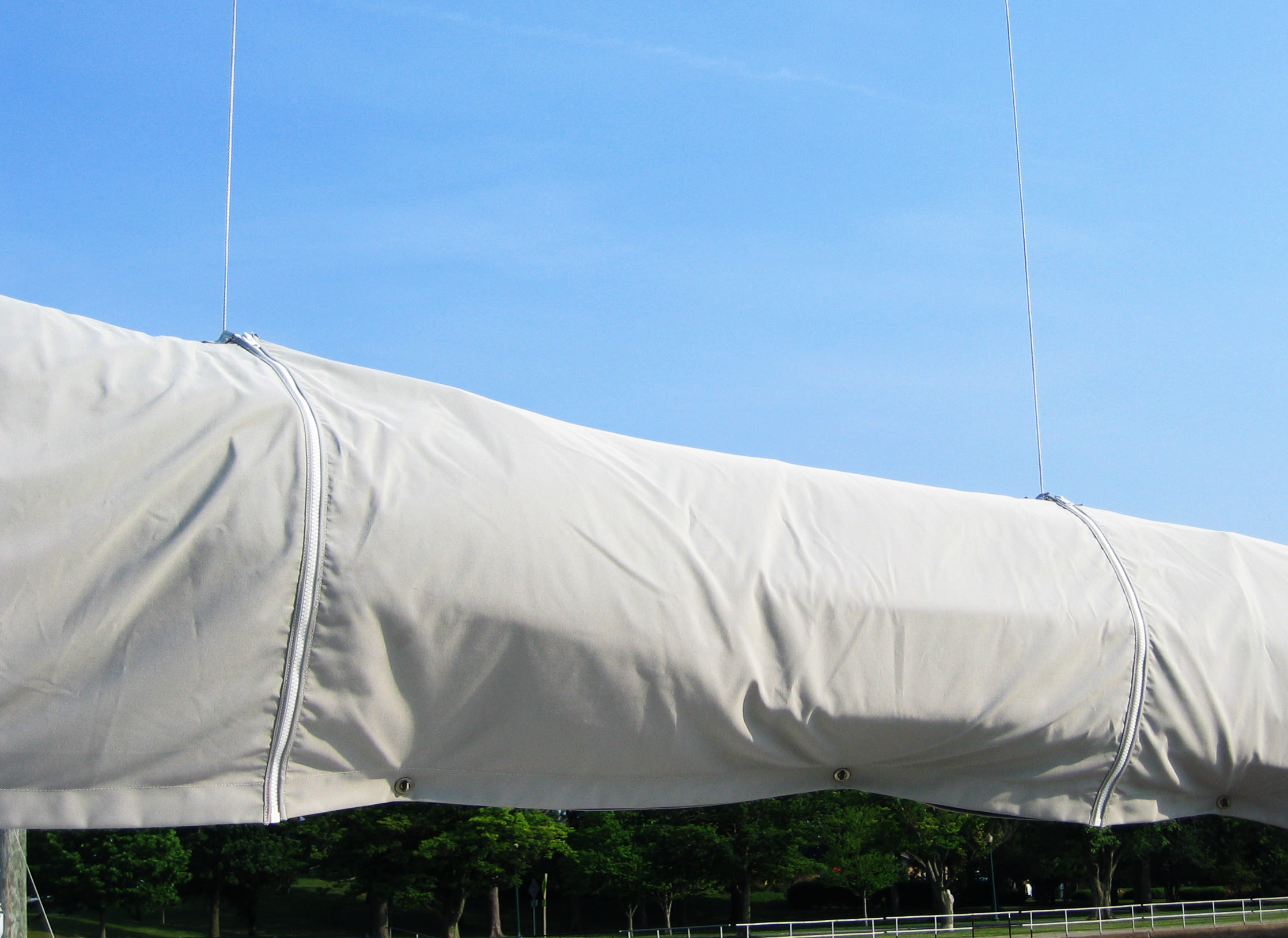 A close up of the carefully placed zipper slits in a mainsail cover.