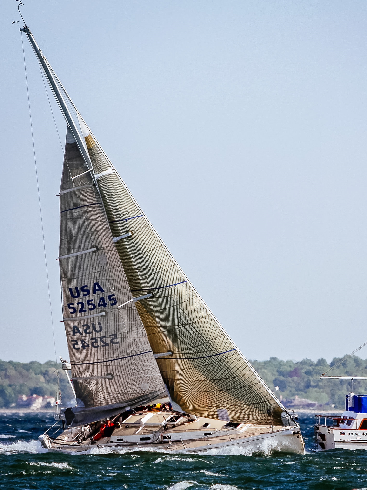 A J/133 finishing a race in 40 knots with a Tape-Drive Carbon/Aramid No. 4 and two reefs.