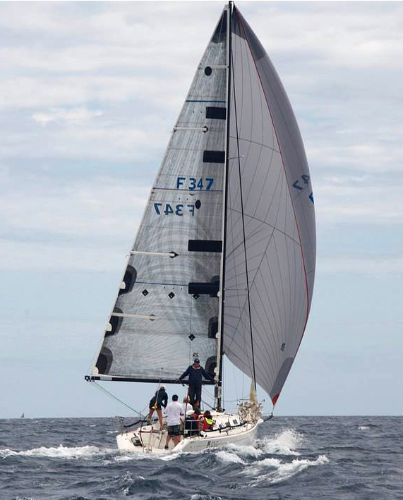The Beneteau First 34.7 CIRCA running in heavy air with an A3