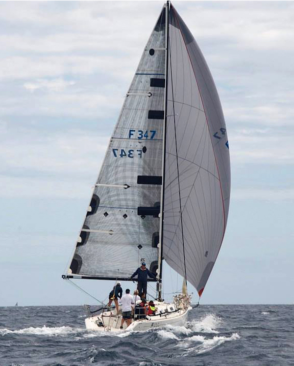 The Beneteau First 34.7 DYNAMIC saying deep in heavy air with her UK Sailmakers A3.