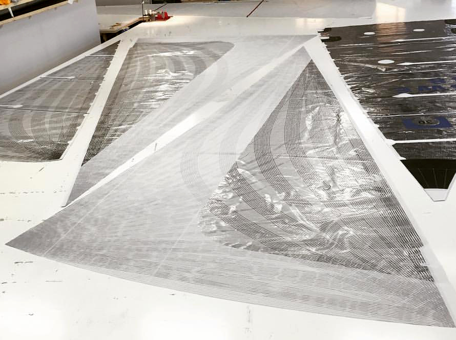 Two carbon X-Drive genoas with a partial taffeta layer over part of the sail that overlaps the mast. This prevents the mylar over the tapes from being abraded as the sail comes in contact with the mast and shrouds during tacks.