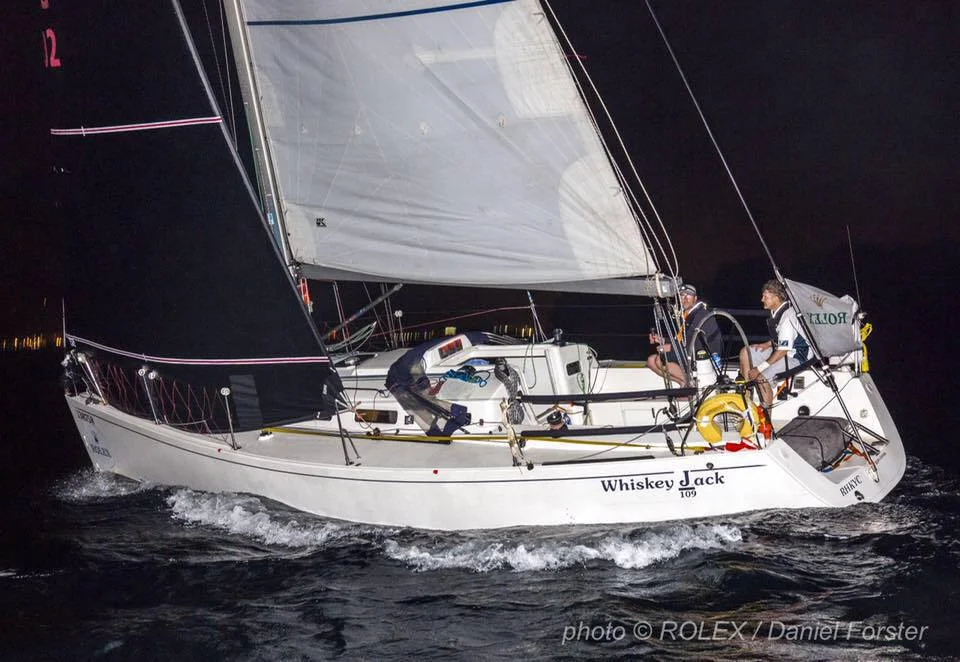 The J/109 WHISKEY JACK crossing the finish line in Subic Bay after a windy China Sea Race.