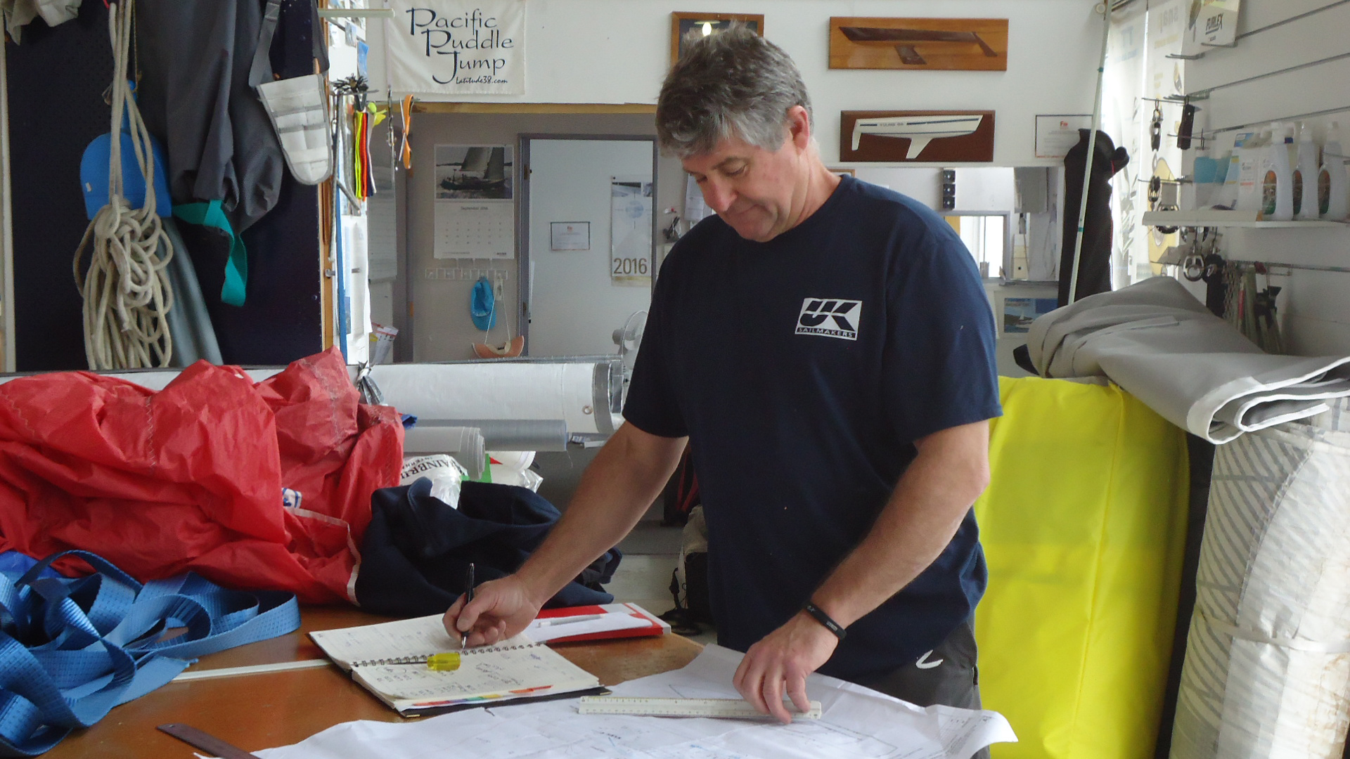 Phil "Phizzle Houghton planning out a new set of sails.