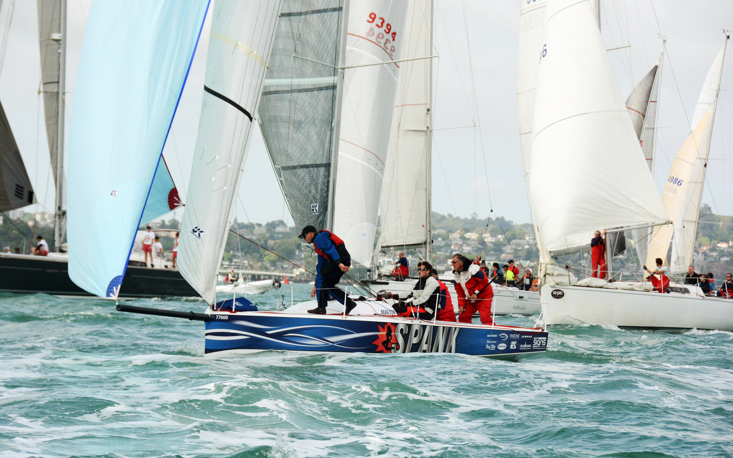 SPANK racing with her UK Sailmakers Titanium main, Tape-Drive genoa and asymmetrical spinnaker.