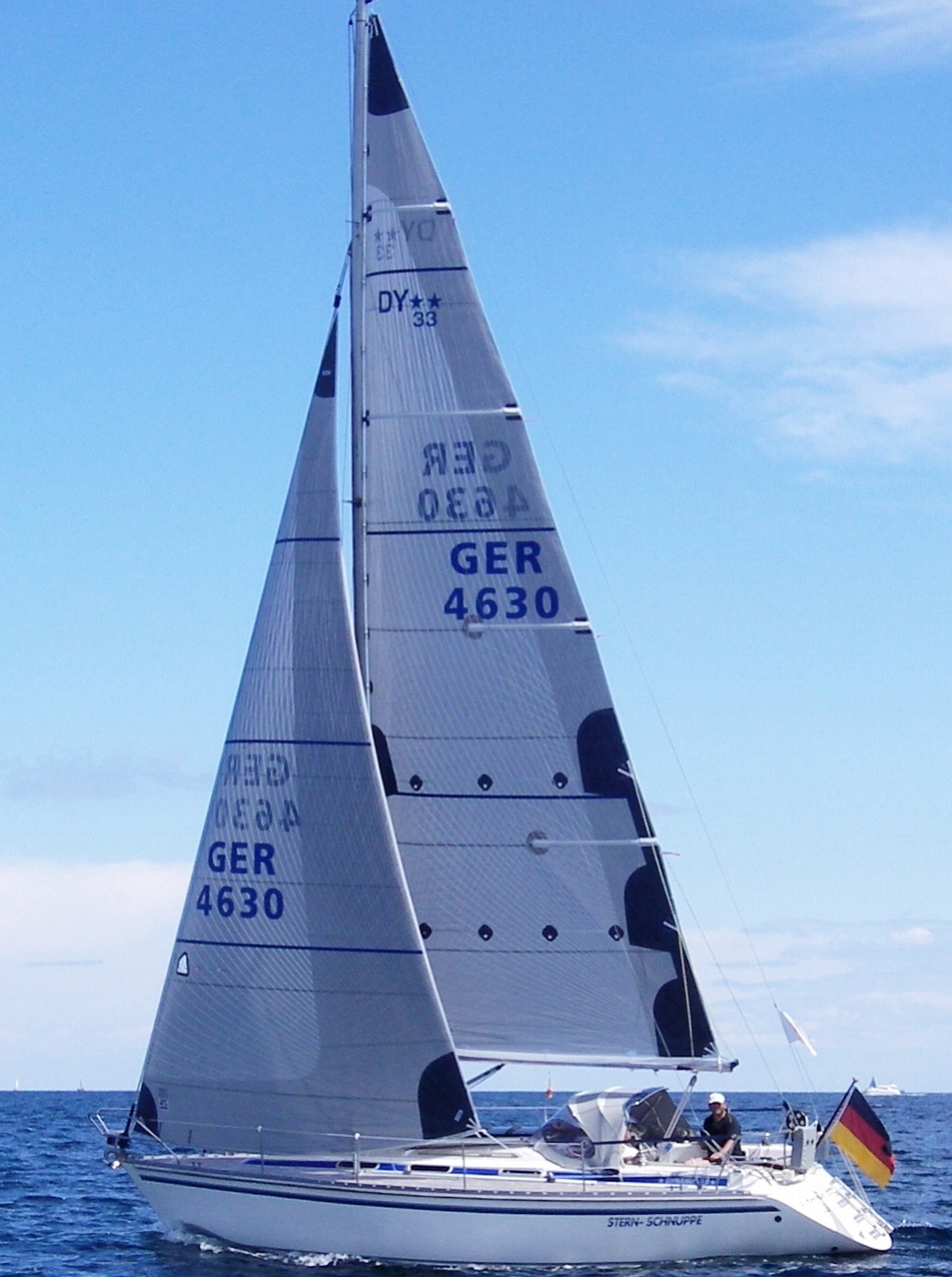 The genoa shown above has taffeta on the part of the sail overlapping the mast to protect the reinforcing fibers and the sail's mylar layer. This boat's mainsail also has a partial taffeta layer up the whole leech.