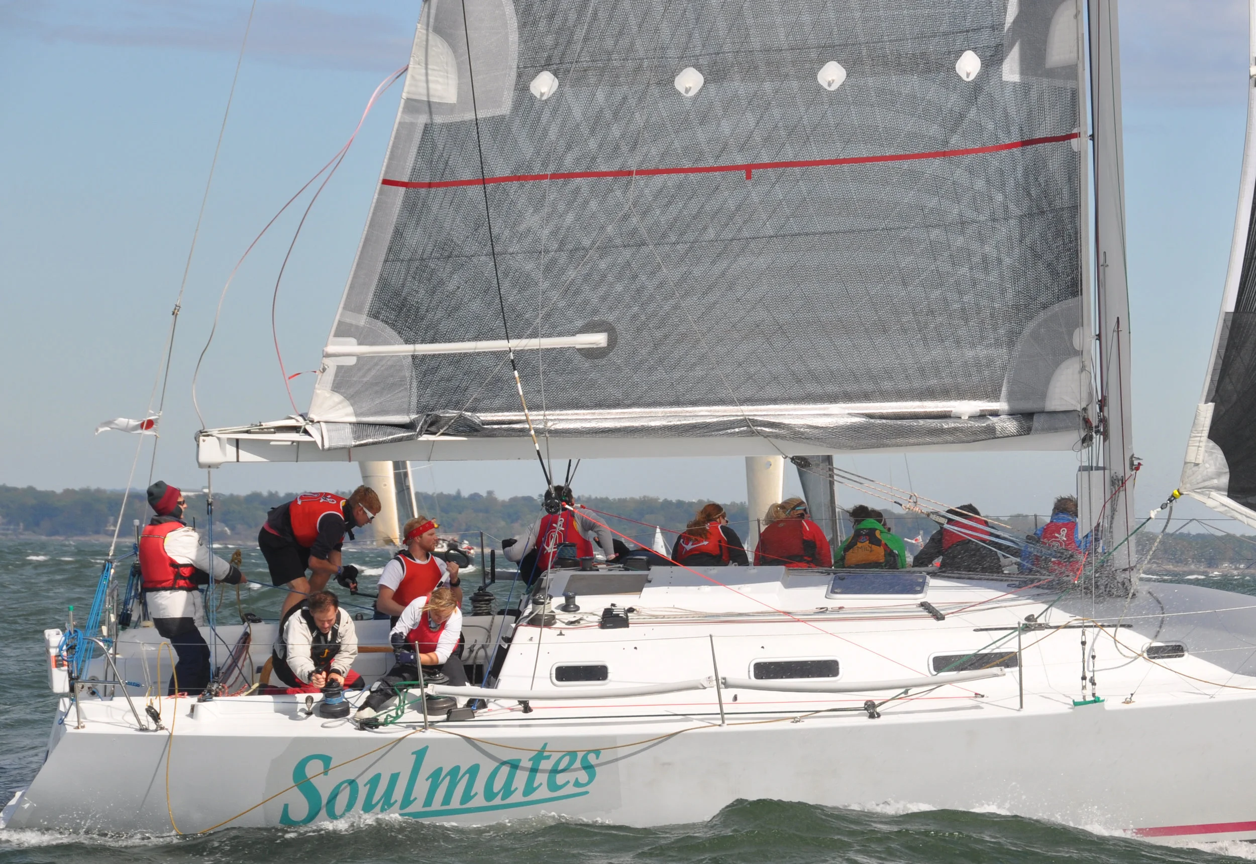 Photo 1 : Notice how tight the reefed foot is. Just the normal outhaul gets pulled tight when he breeze it up to flatten the main, the reef outhaul has to be tight to flatten the sail.