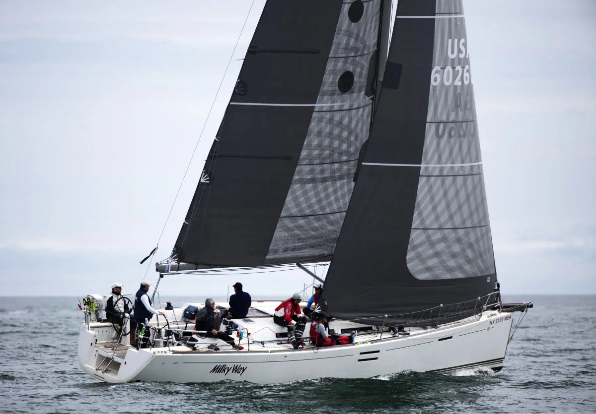 A Dufour 40E with X-Drive carbon sails a partial black taffeta protection. The taffeta is applied over the tapes on the genoa to protect the part of the leech that gets dragged across the shrouds and the mast every time the boat tacks. The mainsail has a partial taffeta layer on the leech to reduce the harmful effects of luffing and flogging.