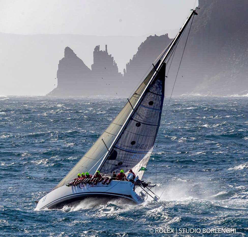 The Salona 44 ANGER MANAGEMENT rounding the Organ Pipes off Tasmania’s Cape Raoul. Storm Bay is living up to its name with the wind blowing 35 knots forcing ANGER MANAGEMENT to sail with a double reef and No. 4 genoa.