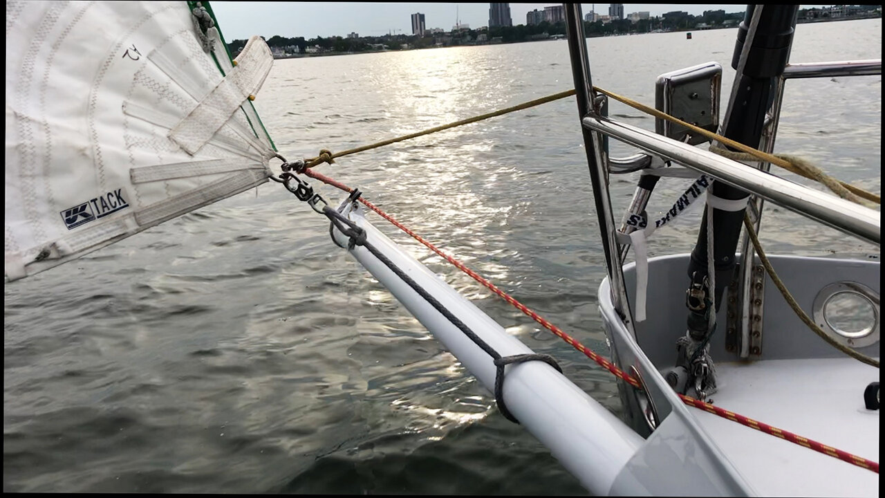 This picture shows the changing strop, the tackling (red) and the retrieval line (yellow). In the picture the tackling is being tightened to move the spinnaker tack out to the end of the sprit.
