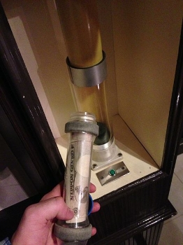 Please Pay Here. Pneumatic tube facilitates the anonymity of the Japanese love hotel. Photo credit : Karl Baron.