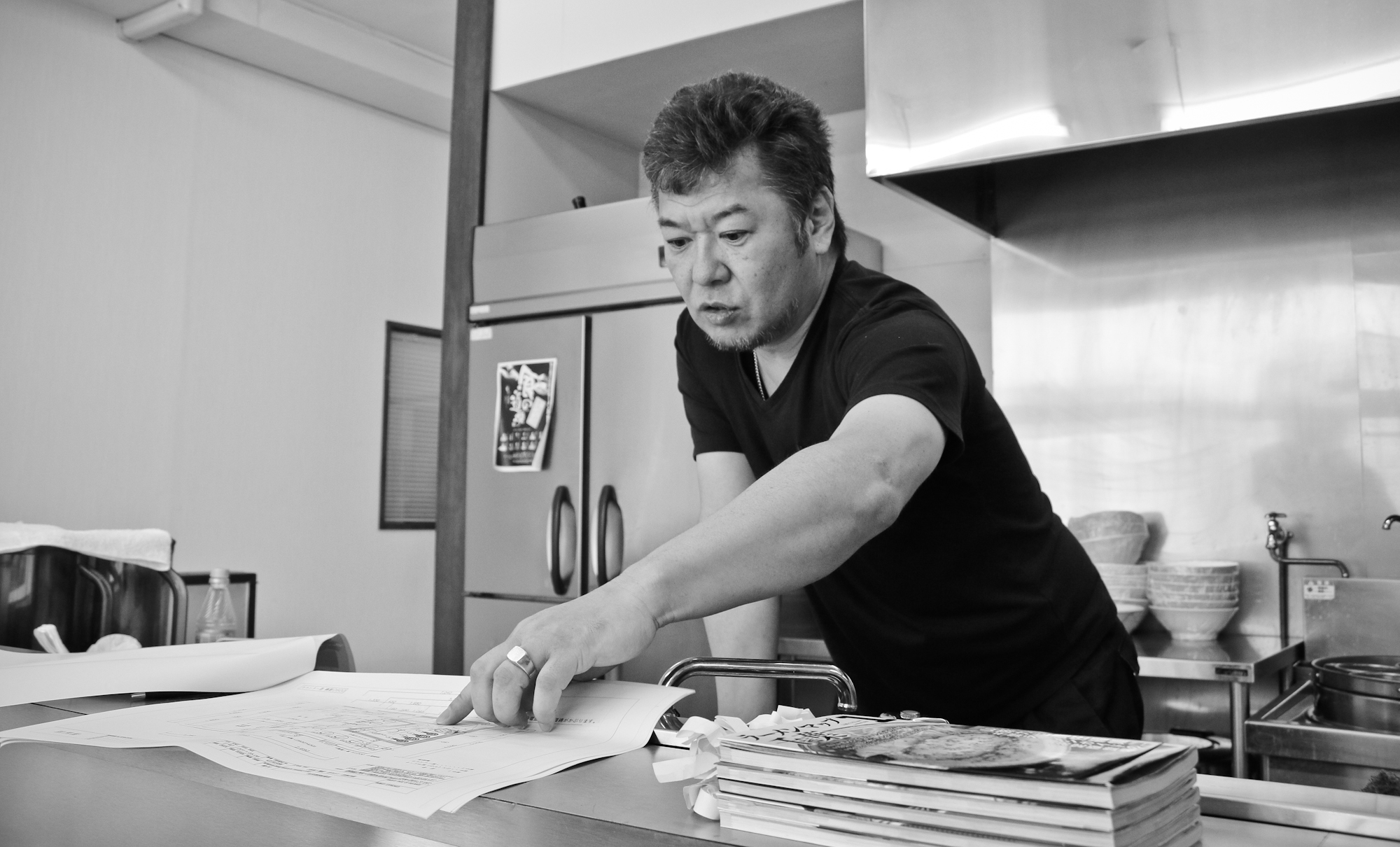 Ramen School Chief. Shigekatsu Akimoto of Shoku no Dojo, explaining some of his kitchen designs. 