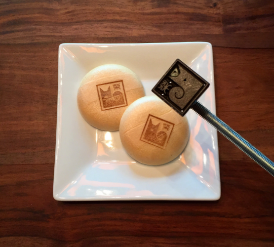 Shiba Ramen Logo, Cast-Iron Brand . We use a single Chinese character ( kanji ) saying only "shiba." The text font and the logo itself evoke a traditional Japanese hanko stamp (see below). Here with our Shiba Scream ice cream prototype (minus the ice cream). 