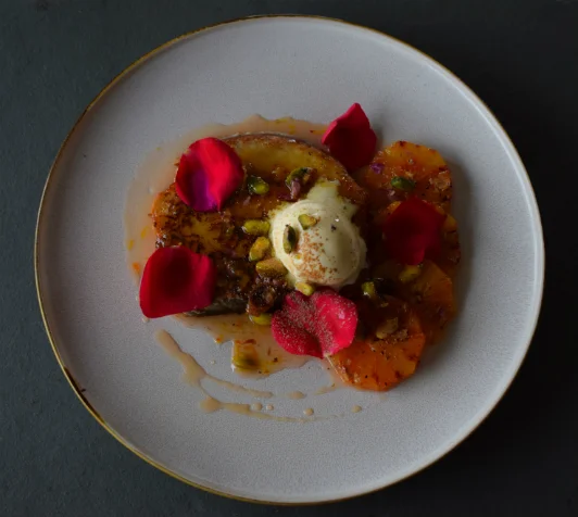 Eggy bread with caramelised blood oranges, rose and pistachios